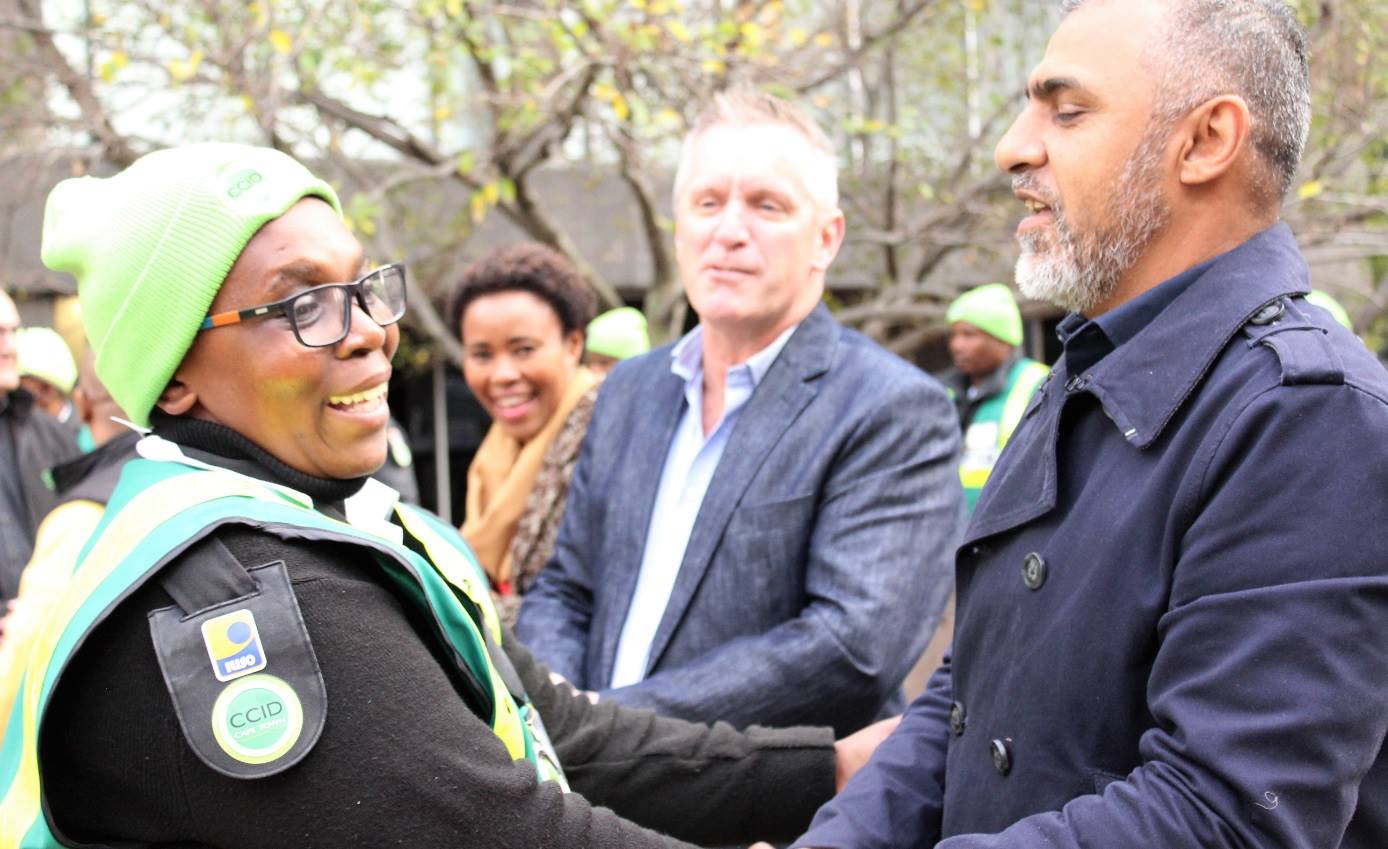 Pelokazi Mbaxa receiving a medal from Muneeb Hendricks