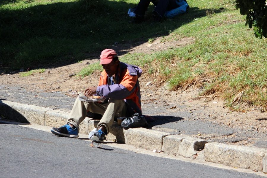 Helping the homeless, a homeless man eating