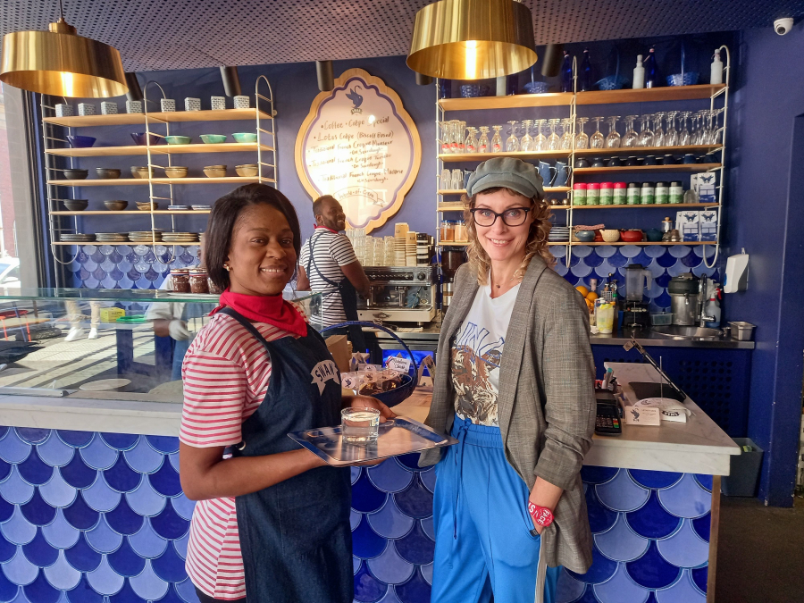 Barista Patou Nimi and server Norah Muangi with Swan Café owner Jessica Rushmere